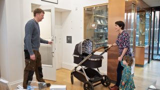 Volunteer assisting with lift